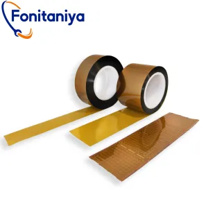 two rolls of PI film tape in amber color, with one QFN packaged IC board