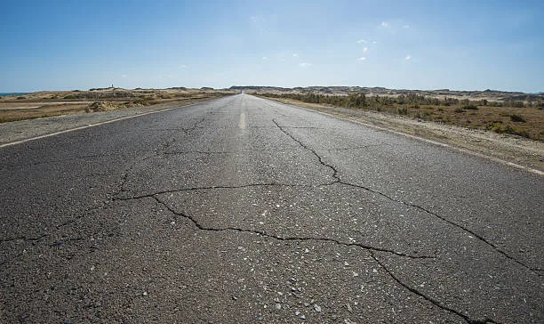 a road crack ready to be repaired by asphalt