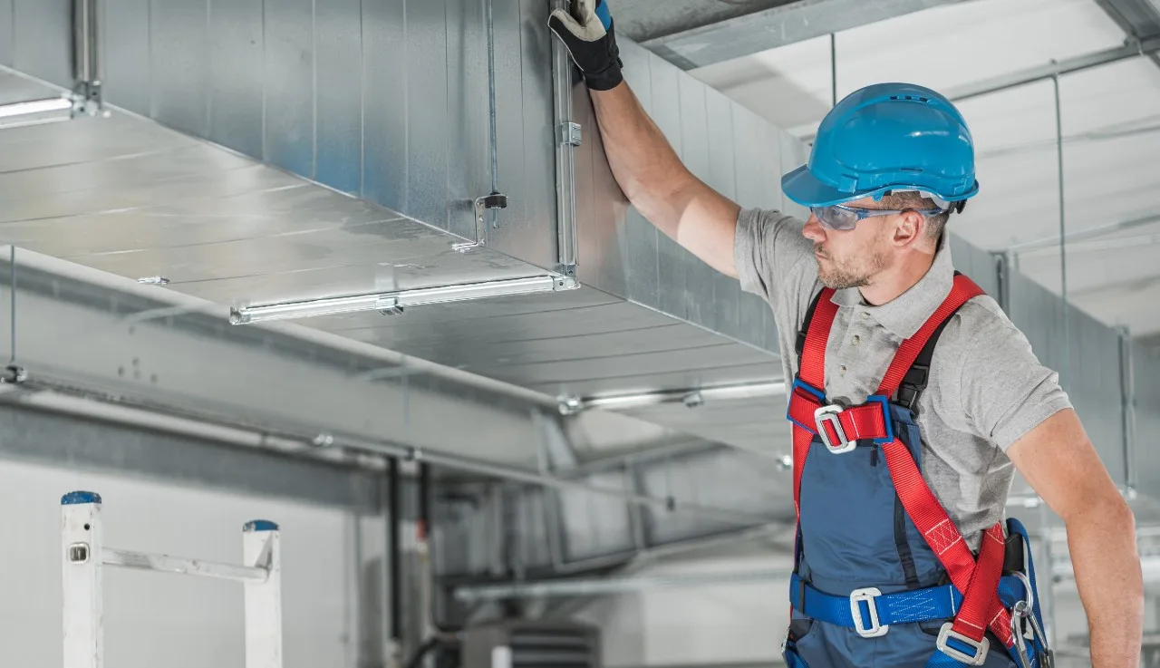 an engineer applying hvac tape