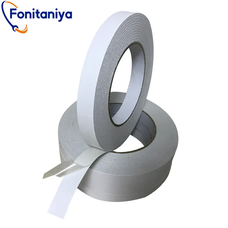 two rolls of double sided tape with low vocs