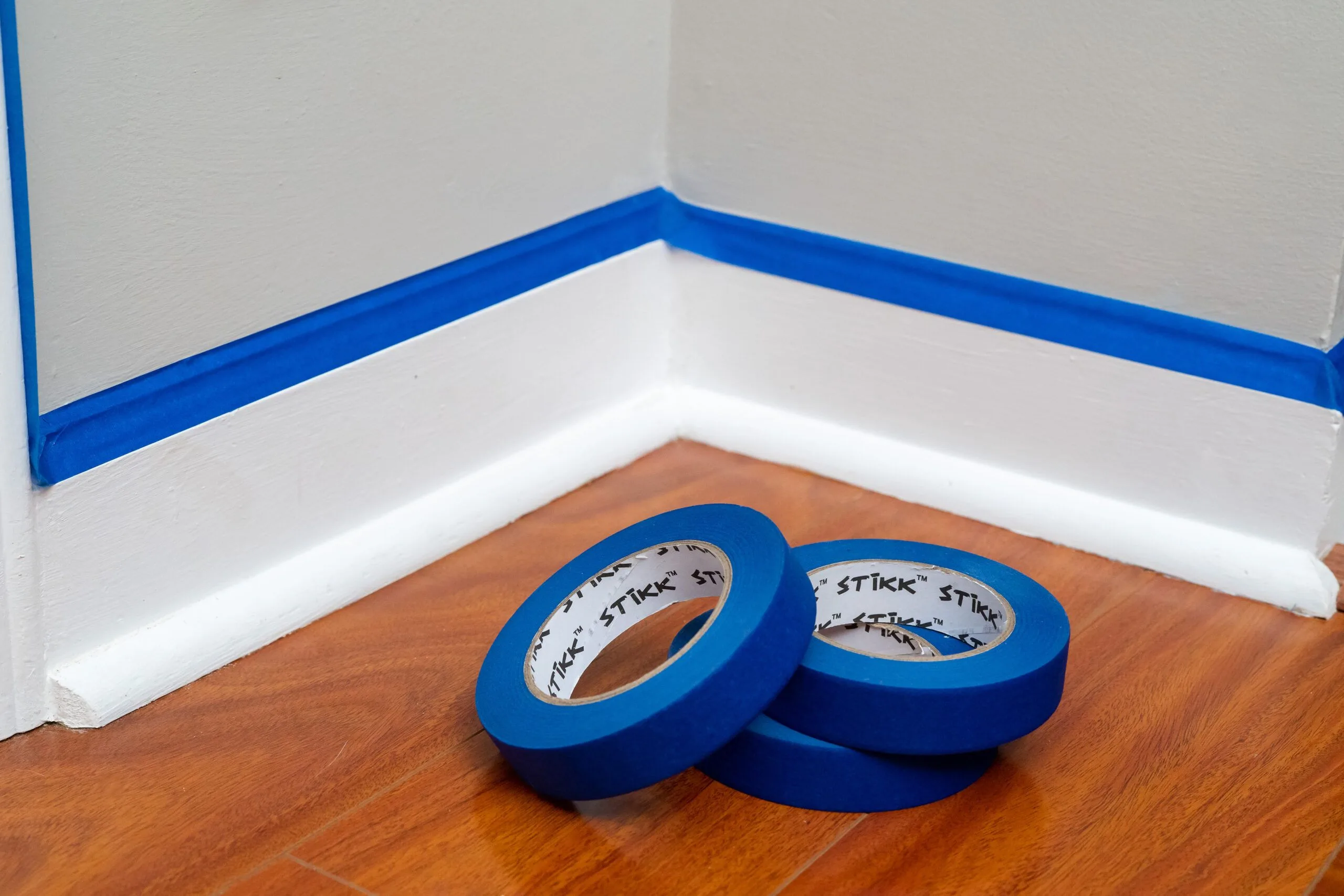 2 rolls of painter's tapes at the corner