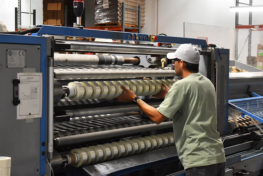 a worker operating packaging tape