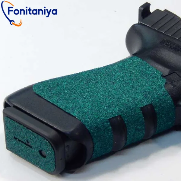 a dark-green grip tape wrapped around a pistol handle