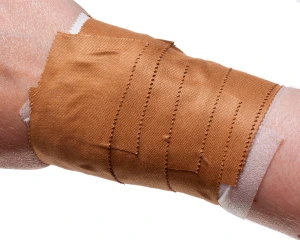 applying zinc oxide tape on wrist